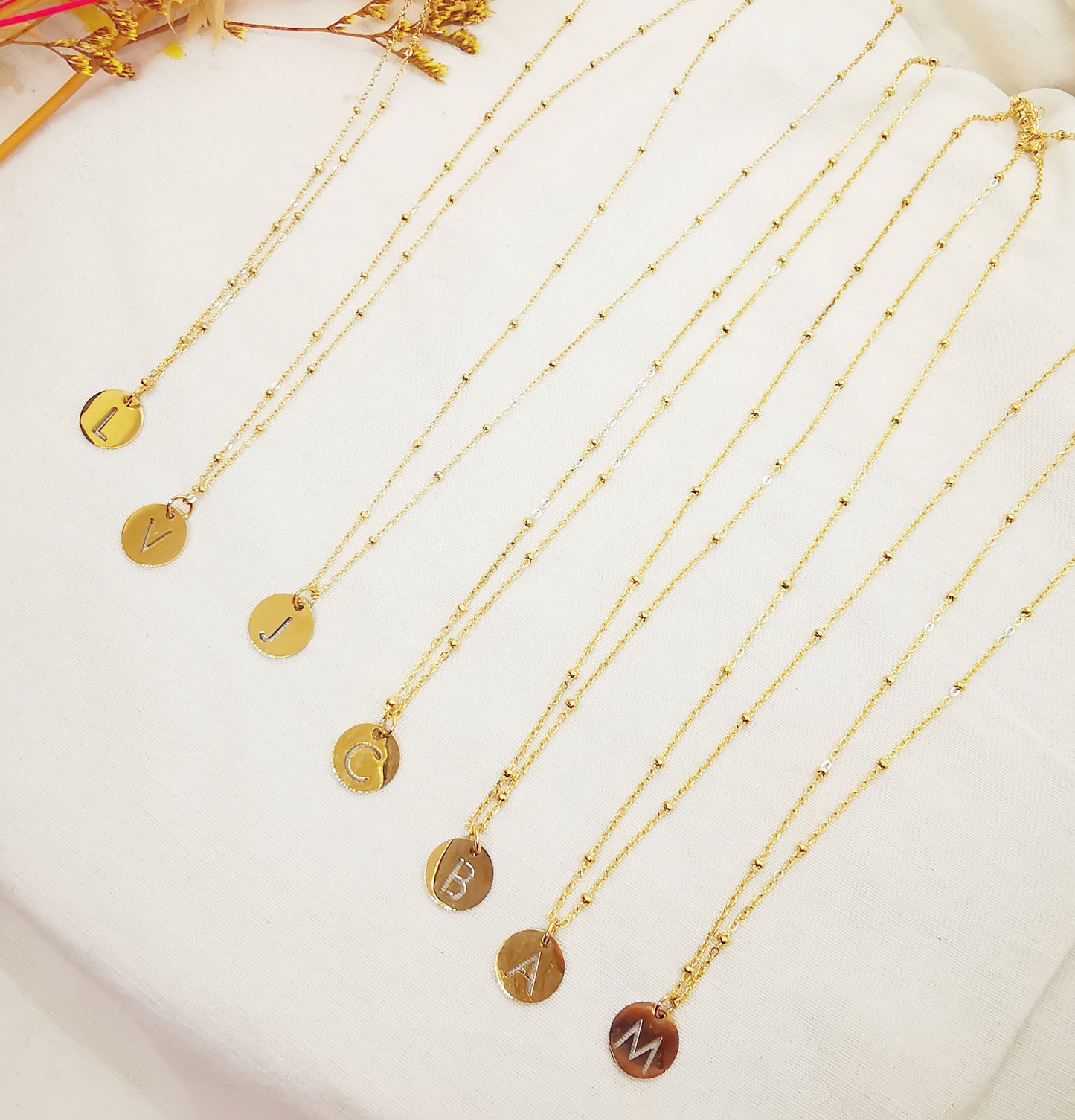 Colliers Initiale J