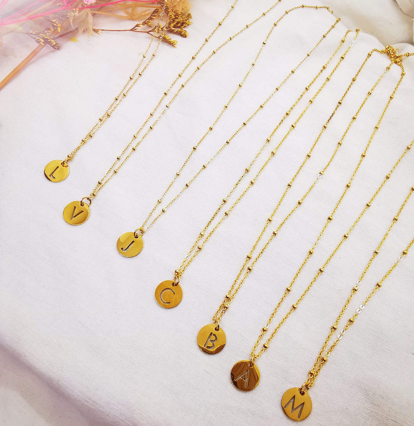 Colliers Initiale M